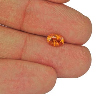 0.87-Carat Orangy Yellow Oval-Cut Clinohumite from Tajikistan - Click Image to Close